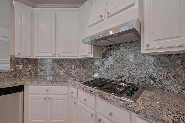 kitchen with white cabinetry, stainless steel appliances, under cabinet range hood, and decorative backsplash