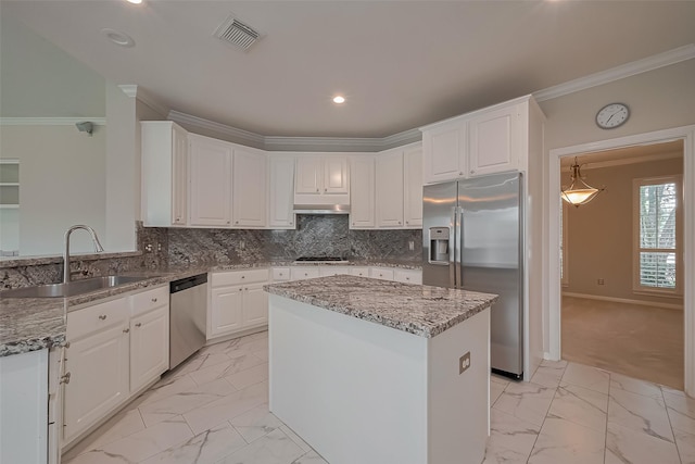 kitchen featuring a sink, visible vents, stainless steel appliances, ornamental molding, and marble finish floor
