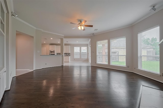 unfurnished living room featuring ornamental molding, ceiling fan, and dark wood-style flooring