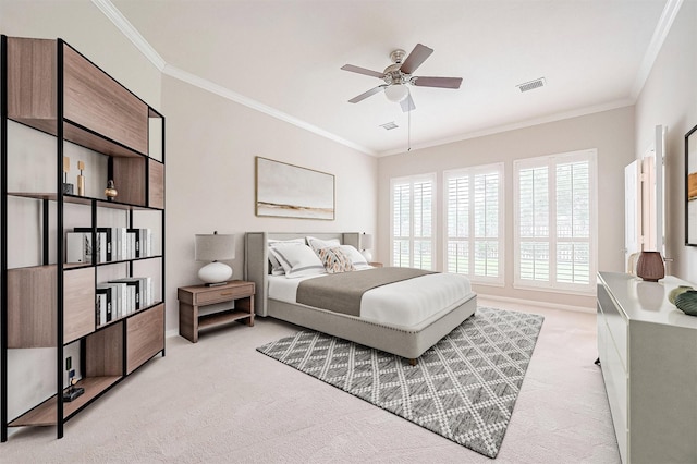 bedroom with visible vents, ceiling fan, ornamental molding, and light carpet