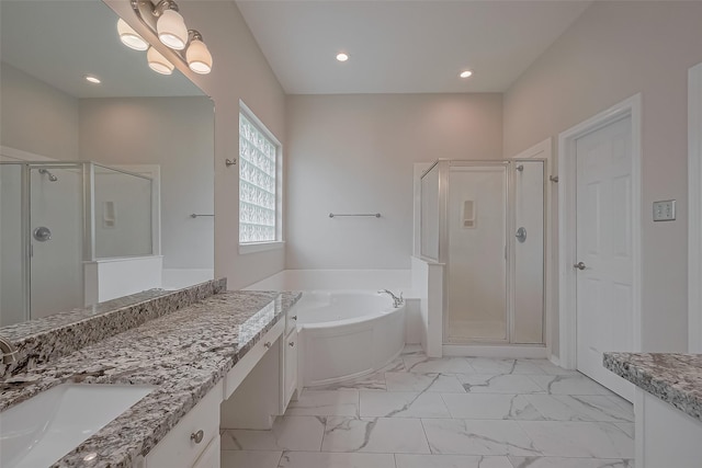 bathroom with a stall shower, a garden tub, vanity, and marble finish floor