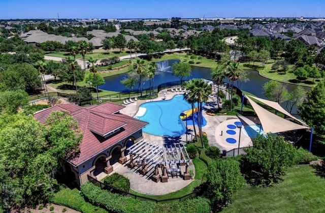 birds eye view of property with a water view