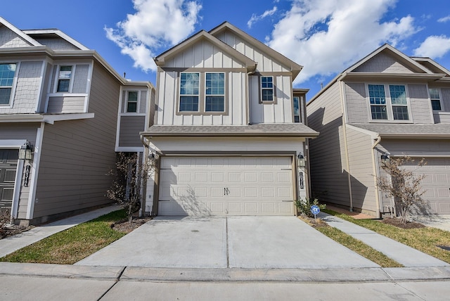 view of front of house featuring board and batten siding, concrete driveway, and an attached garage