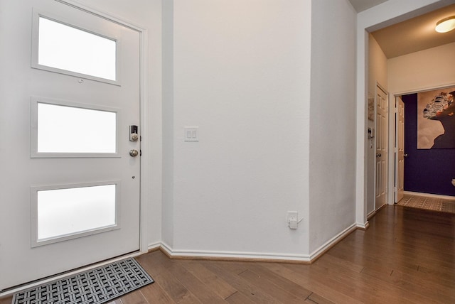 entryway featuring wood finished floors and baseboards