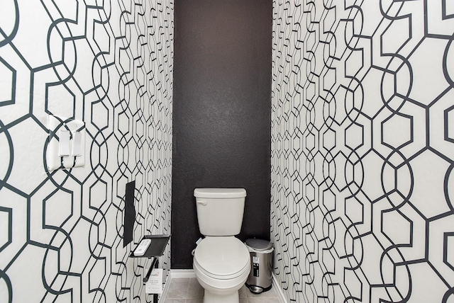 bathroom featuring toilet and tile patterned floors