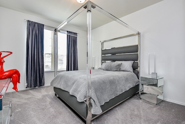 bedroom featuring baseboards and carpet floors