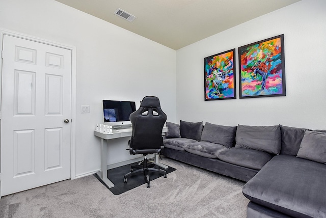 carpeted office with visible vents and baseboards