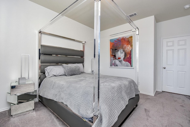 carpeted bedroom featuring visible vents and baseboards
