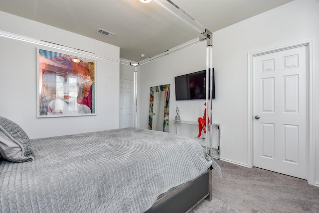 carpeted bedroom with visible vents