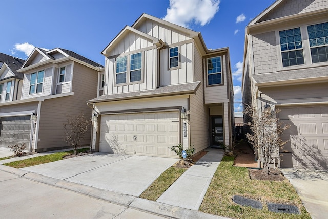 view of front of home with board and batten siding, concrete driveway, and a garage
