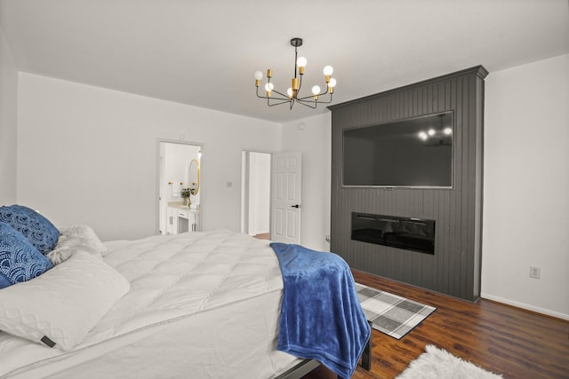 3631 Belmont Shore Ln, Missouri City, TX 77459 - bedroom with a chandelier, wood finished floors, a fireplace, and baseboards