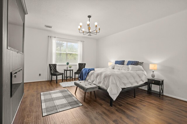 3631 Belmont Shore Ln, Missouri City, TX 77459 - bedroom with a chandelier, wood finished floors, and baseboards