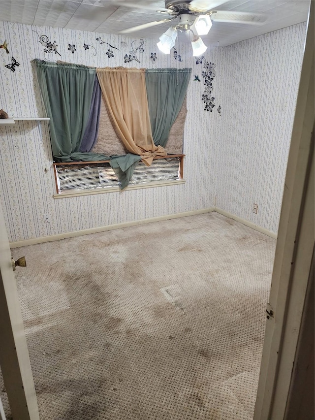 918 Redondo Dr, Houston, TX 77015 - spare room featuring wallpapered walls, carpet floors, and ceiling fan
