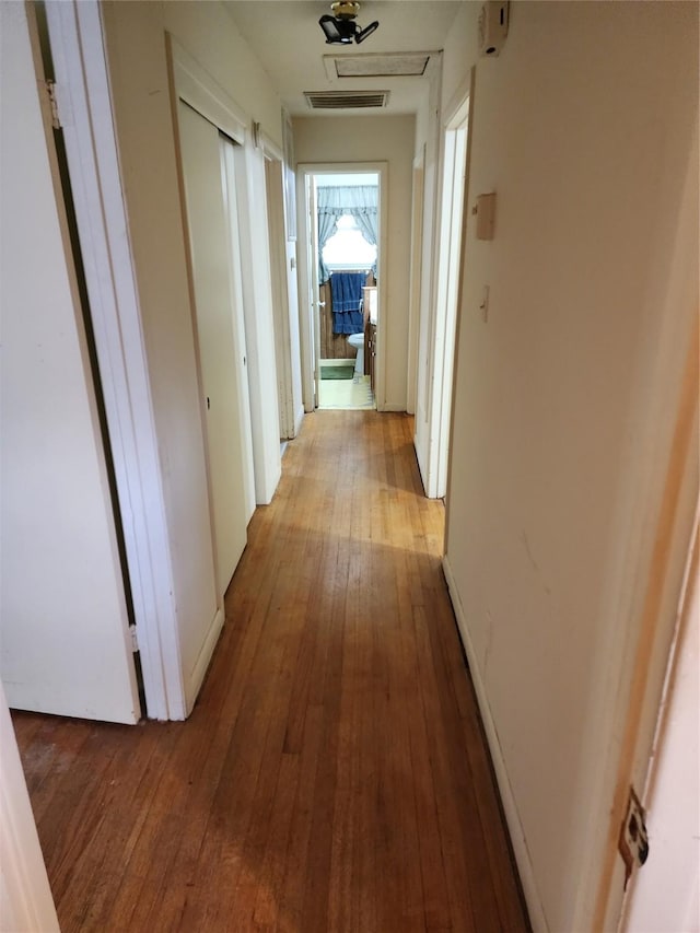 918 Redondo Dr, Houston, TX 77015 - hall featuring hardwood / wood-style flooring and attic access