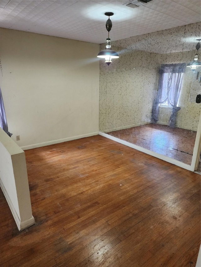 918 Redondo Dr, Houston, TX 77015 - unfurnished dining area with baseboards and hardwood / wood-style floors