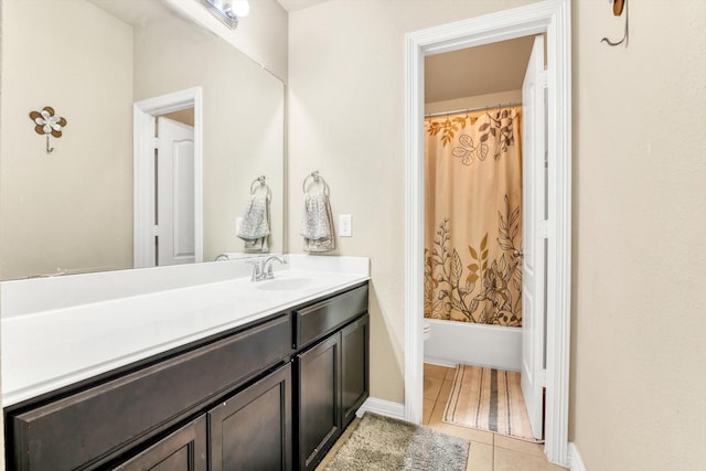 full bathroom with tile patterned flooring, shower / bathtub combination with curtain, toilet, vanity, and baseboards