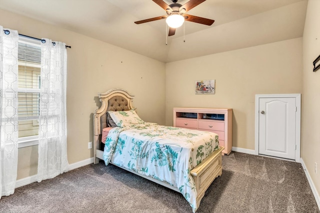 carpeted bedroom featuring baseboards, a ceiling fan, and vaulted ceiling