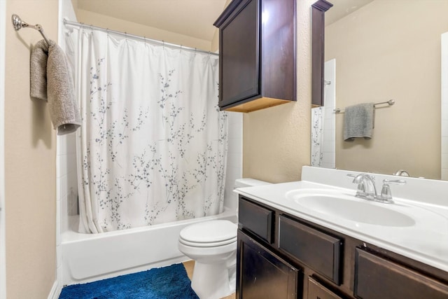 bathroom with shower / tub combo, toilet, and vanity