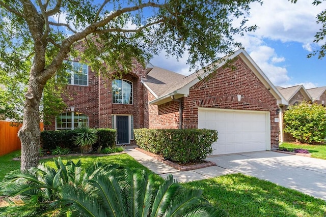 3035 Cimarron Pass Dr, Spring, TX 77373 - traditional home featuring brick siding, an attached garage, fence, and driveway