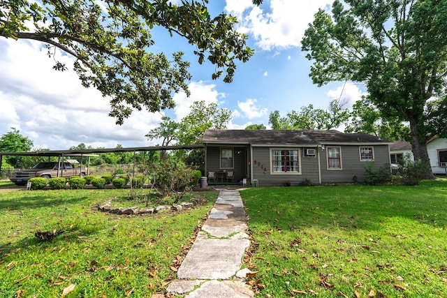 5514 Pardee St, Houston, TX 77026 - ranch-style home featuring a front yard and a carport