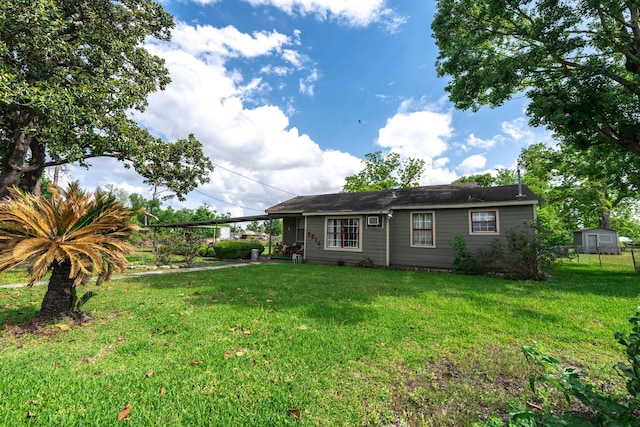 5514 Pardee St, Houston, TX 77026 - view of front facade with a front yard and an attached carport