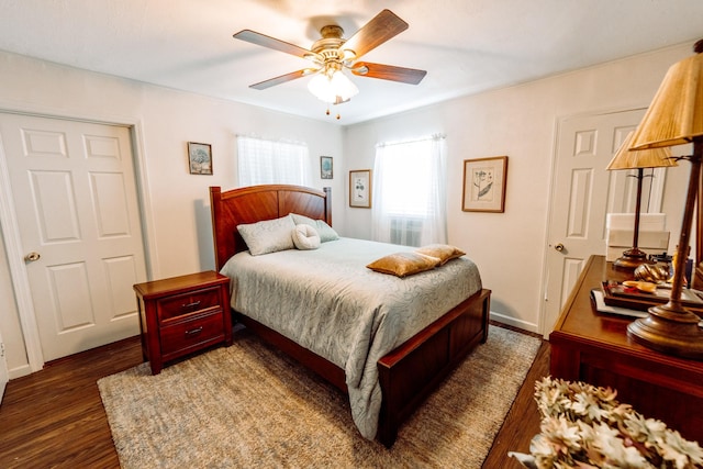 5514 Pardee St, Houston, TX 77026 - bedroom with baseboards, a ceiling fan, and dark wood finished floors