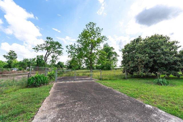 5514 Pardee St, Houston, TX 77026 - view of road with a gate and aphalt driveway