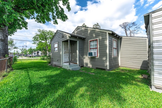 5514 Pardee St, Houston, TX 77026 - back of house with a lawn, fence, and cooling unit