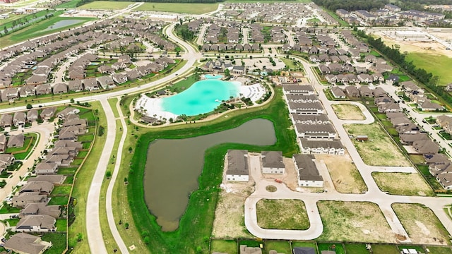aerial view featuring a water view and a residential view