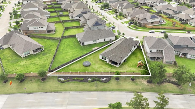 birds eye view of property with a residential view