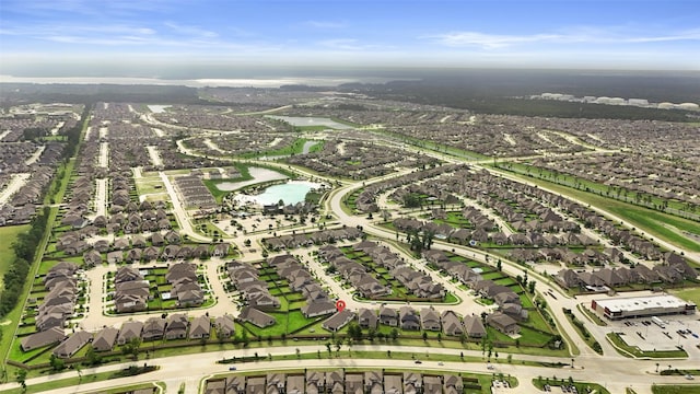 bird's eye view with a residential view and a water view