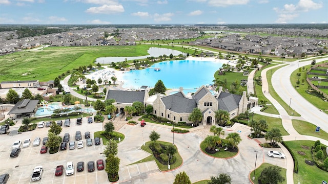 birds eye view of property featuring a residential view and a water view