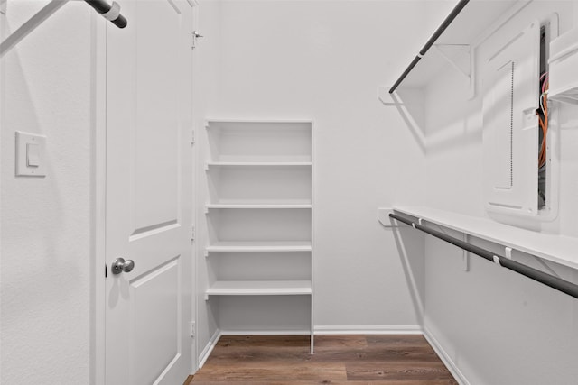 spacious closet with wood finished floors