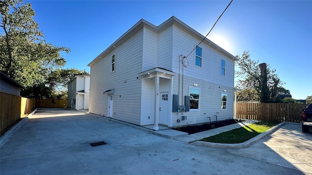 exterior space with fence and driveway