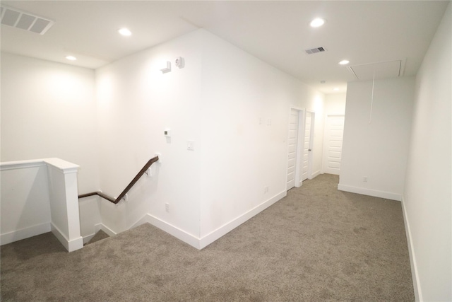 interior space with carpet floors, recessed lighting, and visible vents