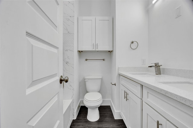 4512 Brinkley St A-B, Unit A-B Houston, TX 77051 - full bathroom featuring toilet, double vanity, wood finished floors, a shower, and baseboards