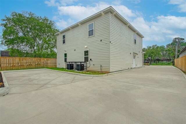 4512 Brinkley St A-B, Unit A-B Houston, TX 77051 - rear view of property featuring fence, central AC, a patio, and concrete driveway