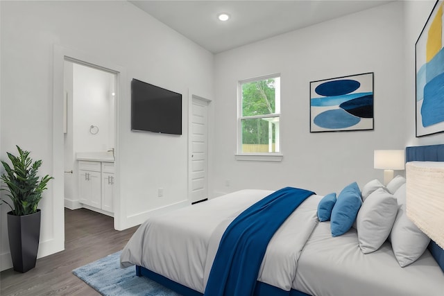 4512 Brinkley St A-B, Unit A-B Houston, TX 77051 - bedroom with dark wood finished floors, connected bathroom, recessed lighting, and baseboards
