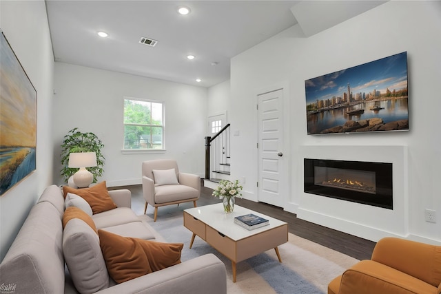 4512 Brinkley St A-B, Unit A-B Houston, TX 77051 - living area featuring wood finished floors, stairway, a glass covered fireplace, recessed lighting, and baseboards