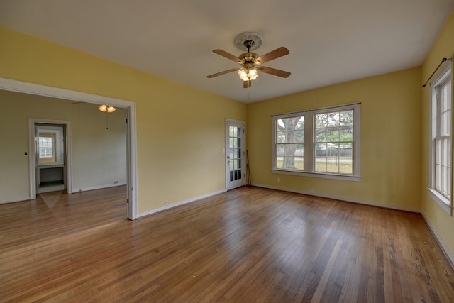 266 Monroe St, Giddings, TX 78942 - unfurnished room with ceiling fan, wood finished floors, and baseboards
