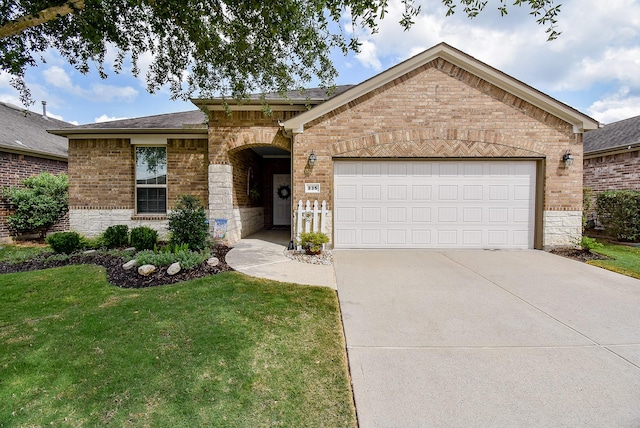 single story home with concrete driveway, a front lawn, brick siding, and an attached garage