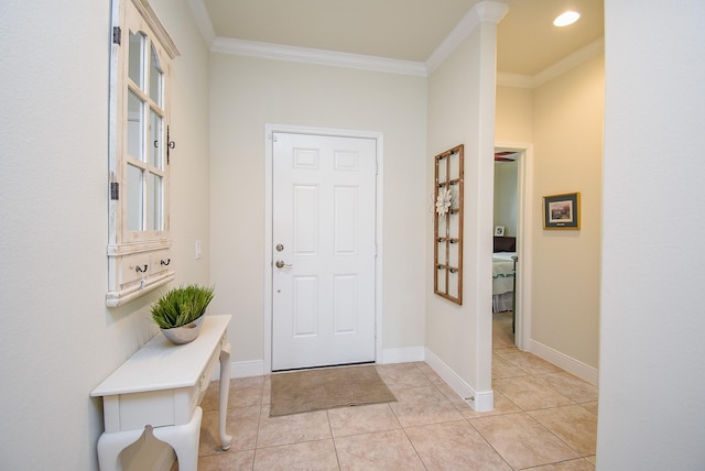 foyer entrance with crown molding, baseboards, light tile patterned floors, and recessed lighting