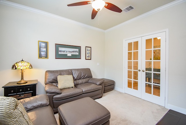 living room with french doors, crown molding, visible vents, baseboards, and ceiling fan
