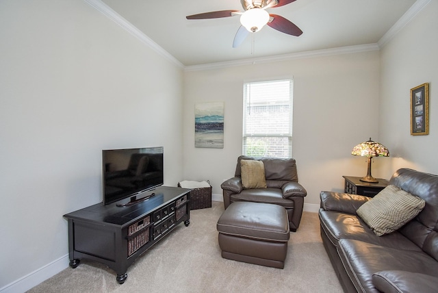 carpeted living area featuring crown molding, baseboards, and ceiling fan