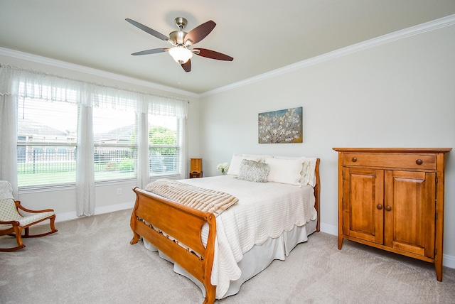 bedroom featuring crown molding, light carpet, baseboards, and a ceiling fan