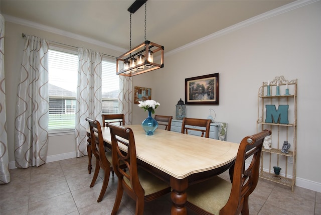 dining area with light tile patterned floors, a chandelier, baseboards, and ornamental molding
