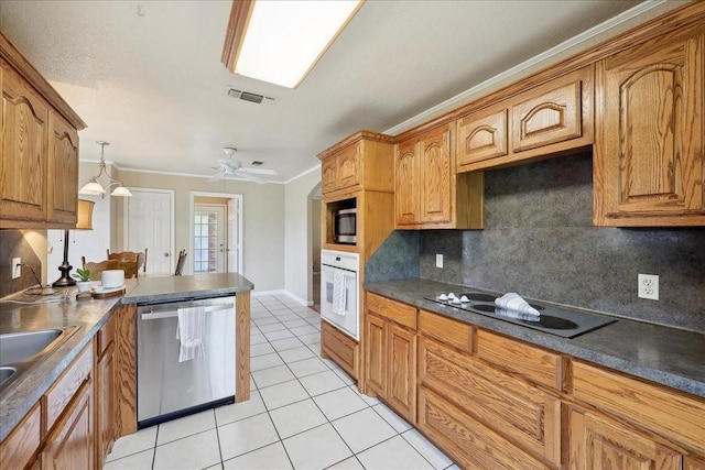 kitchen with stainless steel appliances, decorative backsplash, light tile patterned flooring, visible vents, and dark countertops