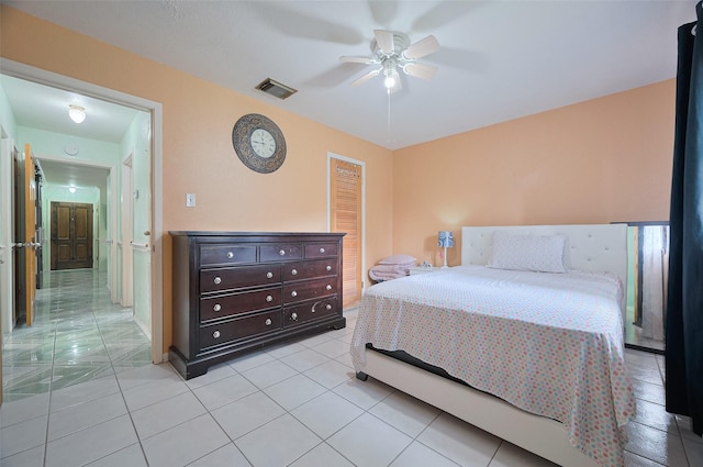 bedroom with visible vents, ceiling fan, and light tile patterned flooring