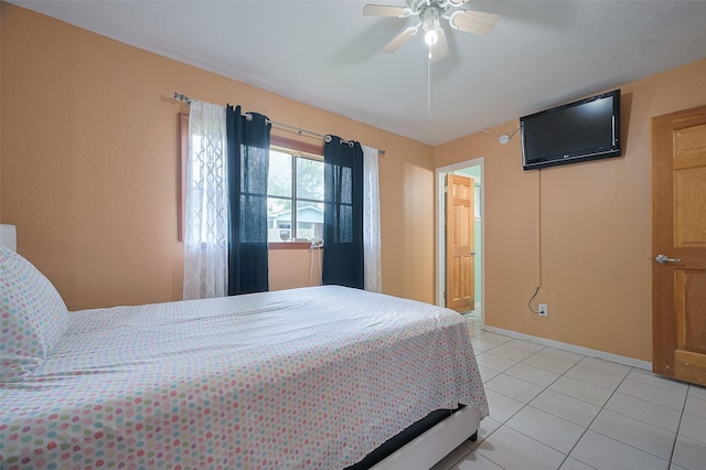 bedroom featuring light tile patterned flooring, ceiling fan, and baseboards