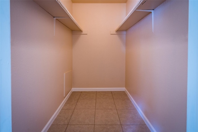 walk in closet featuring light tile patterned floors